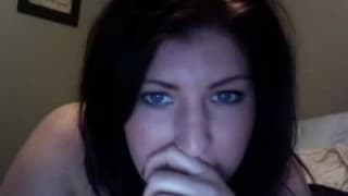 A red dildo for a bored round brunette on camera A red dildo for a bored round brunette on camera