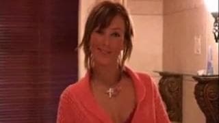 She's a seductive brunette in the shower