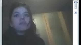 Pretty brunette films herself on webcam