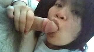 An oriental slut with a cock in her mouth An oriental slut with a cock in her mouth