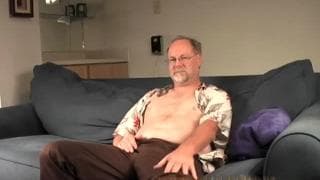 This man jerks himself off on the couch