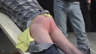 A man dominated by another masked man A man dominated by another masked man