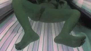 This bitch touches herself on the sunbed