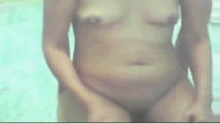 She gets undressed and shows her small tits