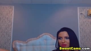 Hot brunette sucks hard on webcam