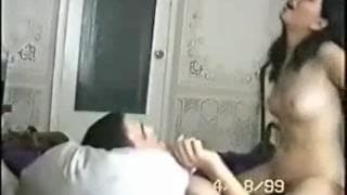 Brunette wife makes her husband cum in bed