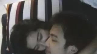 An Asian couple who enjoy fucking in bed