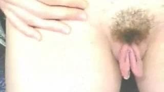 This amateur opens her big pussy lips for us