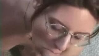 This nerdy milf sucks off her man and more This nerdy milf sucks off her man and more