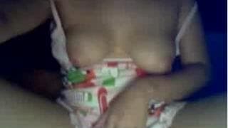 Alone and caressing her body in front of us