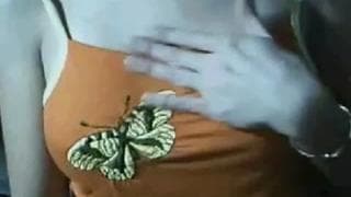 Taking off her top to reveal her nice tits