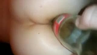 Fucking her arse with a glass cola bottle Fucking her arse with a glass cola bottle