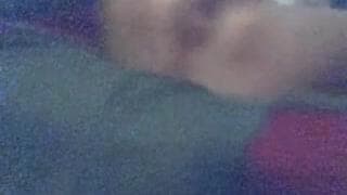 Fucking her own pussy in the bedroom