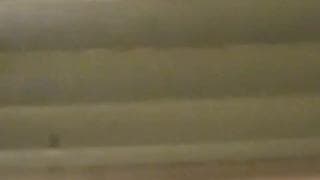 Spying on this milf through the blinds!