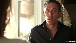 Jill Kassidy shows neighbor what she does with oil