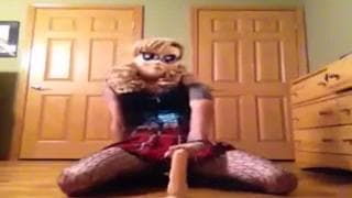 Punk rocker rides a dildo on the floor Punk rocker rides a dildo on the floor