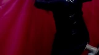 Transsexual dressed in latex riding a dildo Transsexual dressed in latex riding a dildo