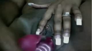 Pink dildo in the black cunt of this chubby woman Pink dildo in the black cunt of this chubby woman