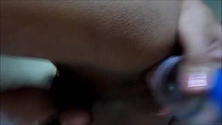 Kam putting a bottle in her ass and wanking Kam putting a bottle in her ass and wanking