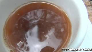 Pregnant woman offers milk to man during picnic