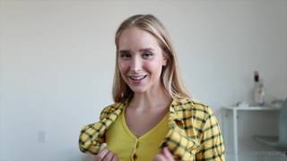 Blonde woman in a stocking lifts her short skirt