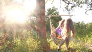 Naked babe masturbating in a hammock outdoors Naked babe masturbating in a hammock outdoors