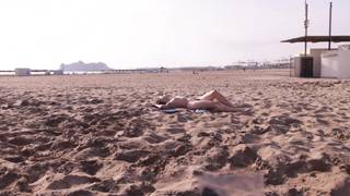 Olivia shows off her tits and even her pussy on the beach