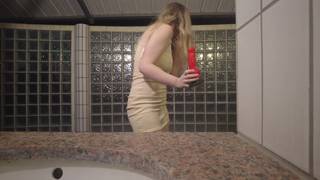 In any public restroom, the French woman films herself masturbating