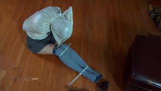 A beautiful woman dominated, tied up and enslaved in a BDSM scene. A beautiful woman dominated, tied up and enslaved in a BDSM scene.