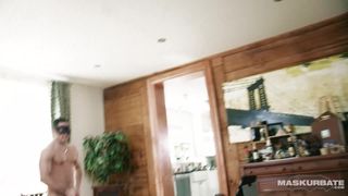 Masked up Carlos is on a chair by himself stroking his cock