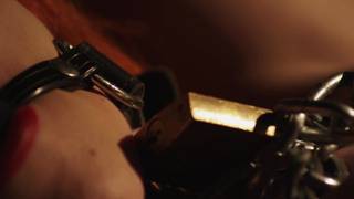 Sensual redhead MILF alone in bed in a BDSM porn with chains Sensual redhead MILF alone in bed in a BDSM porn with chains