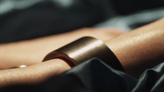 Sensual redhead MILF alone in bed in a BDSM porn with chains