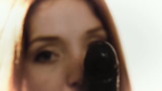 Redhead Red Fox masturbates with a big black dildo