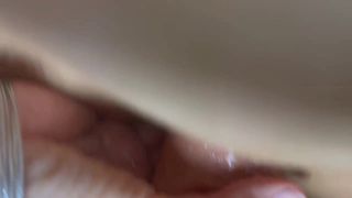She is shoving a big dildo deep into her pussy and loving it